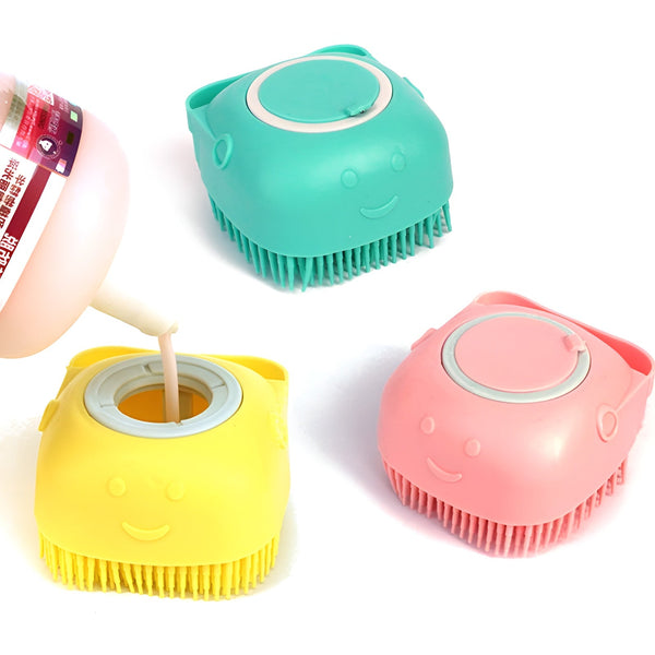 Colorful silicone pet grooming brushes with smiling faces and soap dispenser feature