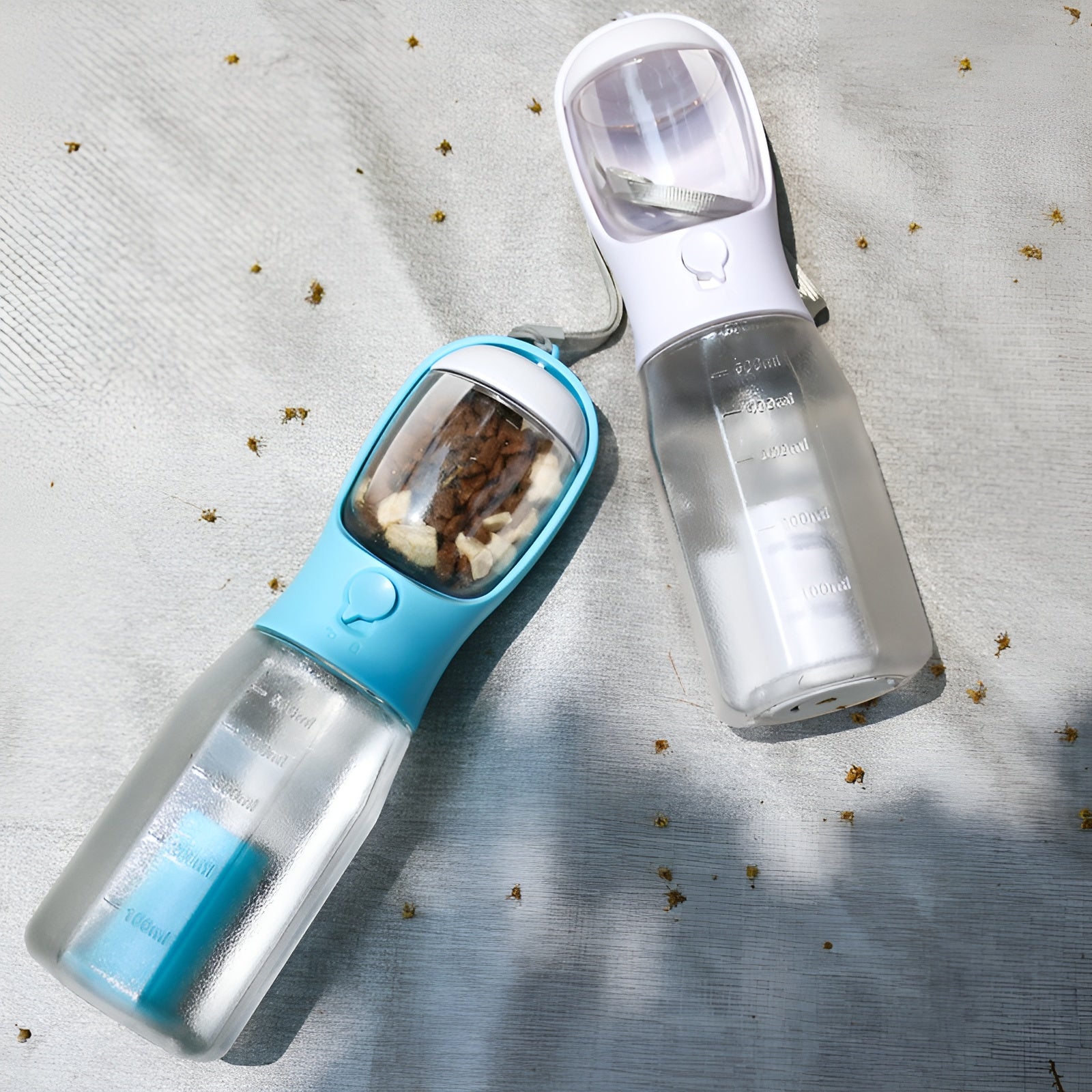 Multifunctional cat and dog travel drinker bottle with a built-in drinking trough.