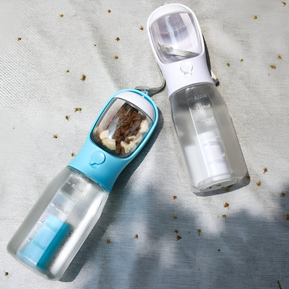 Multifunctional cat and dog travel drinker bottle with a built-in drinking trough.