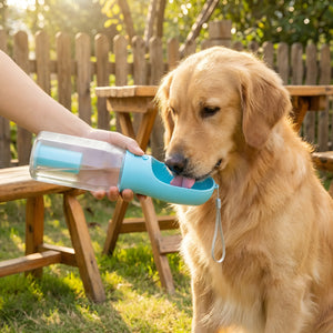 Portable dog water bottle combined with a convenient food feeder compartment.