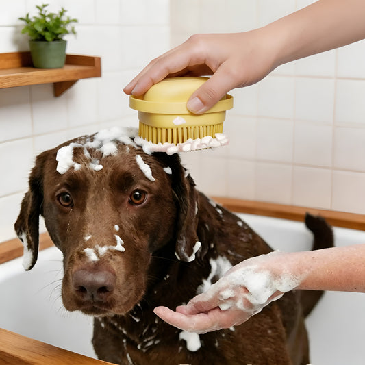 Soft silicone dog bath brush with an integrated shampoo dispenser for easy cleaning.